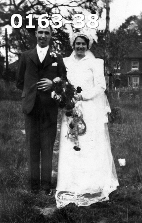 Mr Ted Carter & Miss Joyce Marjoram on the day of their wedding.  1941